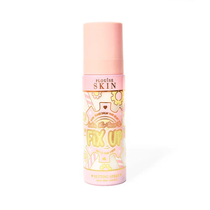 Pink bottle of P. Louise Fix Up Mattifying Setting Spray with pink and yellow gear design on the bottle against a white background