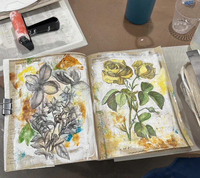Roycycled Art Journal showing pages of watercolor paitned florals