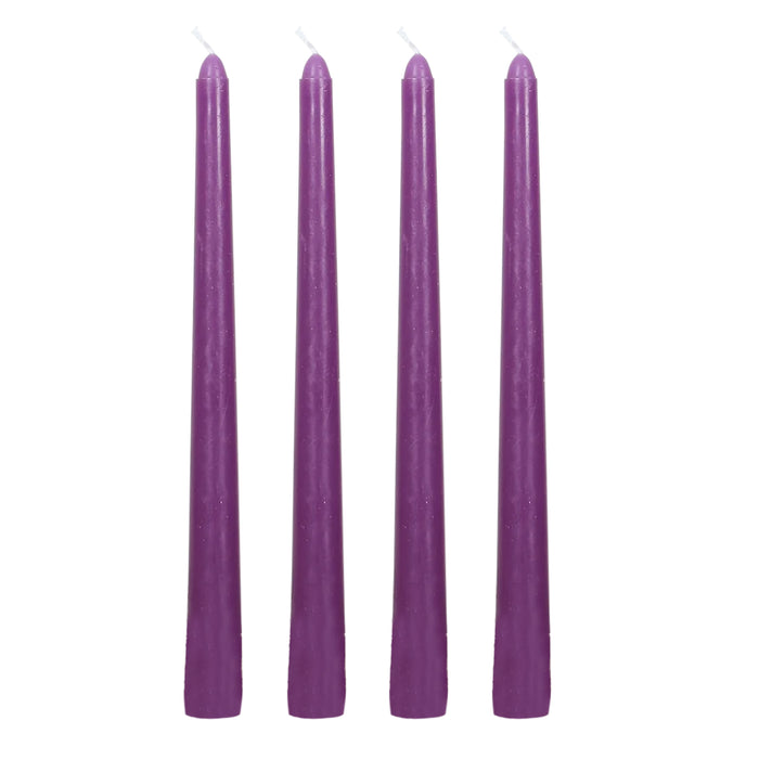 Set of four purple taper candles on a white background #whtbkgd