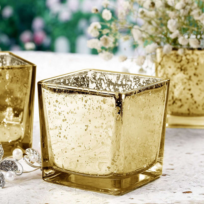 Gold mercury glass candle holder with elegant texture and design.