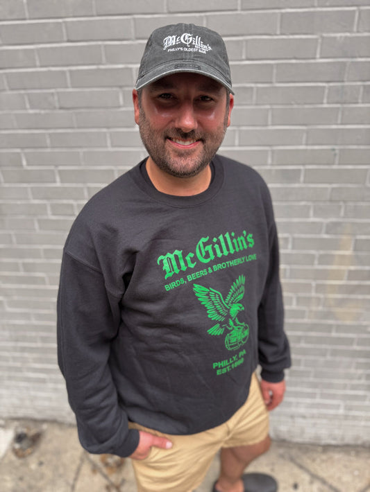 black sweatshirt with green text and logo in green