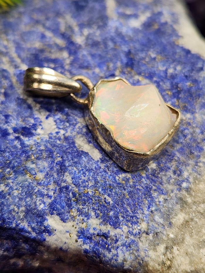 Ethiopian Opal Rough Single Stone Pendant in Silver - A Captivating Display of Nature's Brilliance