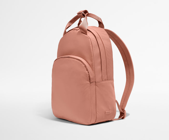 Video of a person packing the Featherlight Backpack with daily essentials
