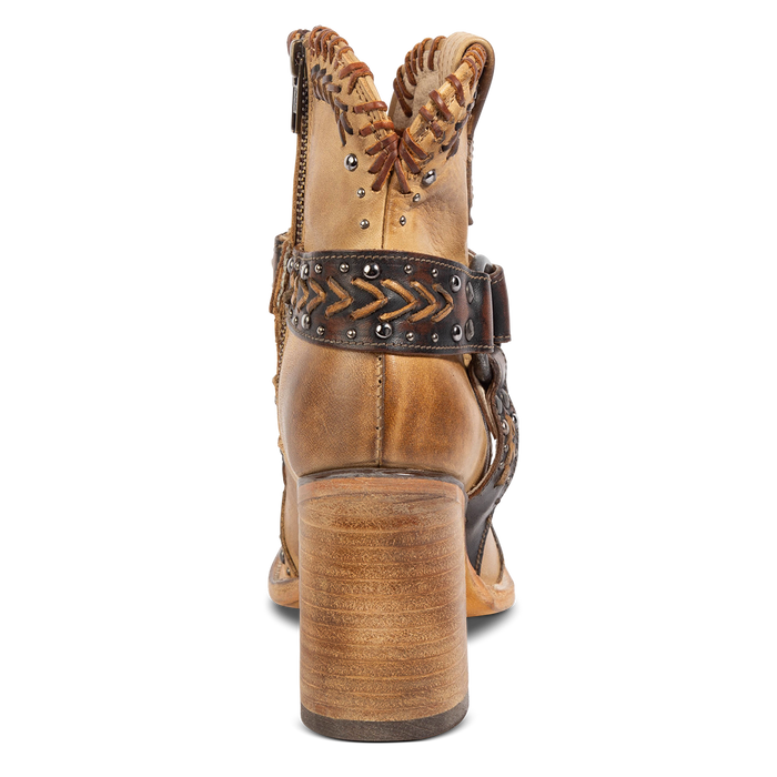 Back view showing a wood stacked heel and detailed heel strap on FREEBIRD women's Jetson tan bootie
