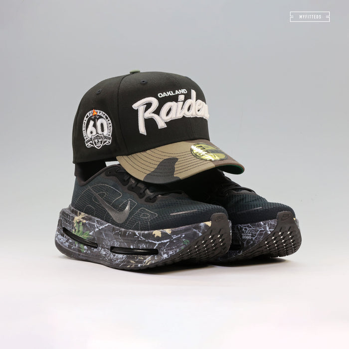OAKLAND RAIDERS 60TH ANNIVERSARY RETRO SCRIPT GITD WOODLAND CAMO NEW ERA FITTED CAP