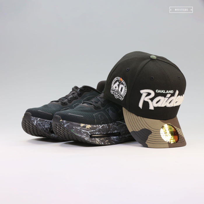 OAKLAND RAIDERS 60TH ANNIVERSARY RETRO SCRIPT GITD WOODLAND CAMO NEW ERA FITTED CAP