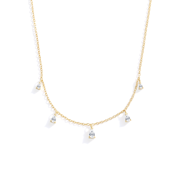 Gold necklace with small diamond-like pendants on a white background