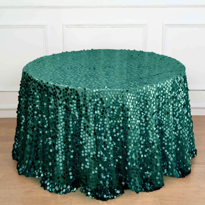 Green sequin tablecloth draped over a round table