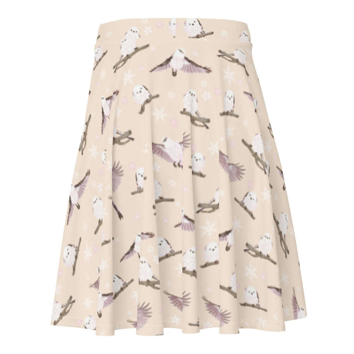 Snow Bird kawaii skater skirt in soft pastels with mid-flight birds and falling snow