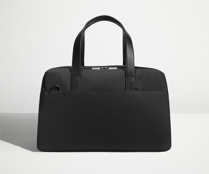 Front view of The Overnight Bag with leather straps up
