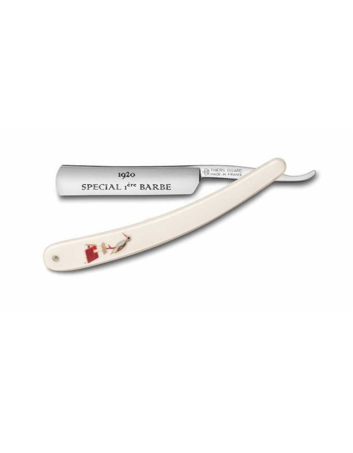 Straight razor with cream-colored handle featuring a decorative design, round point, 4/8 inch blade, engraved '1920 Special 1ère Barbe'.