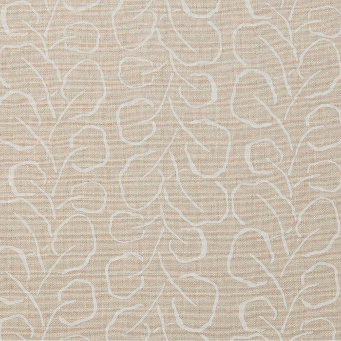 Woven fabric swatch with a large-scale repeating leaf print in white on a cream background.