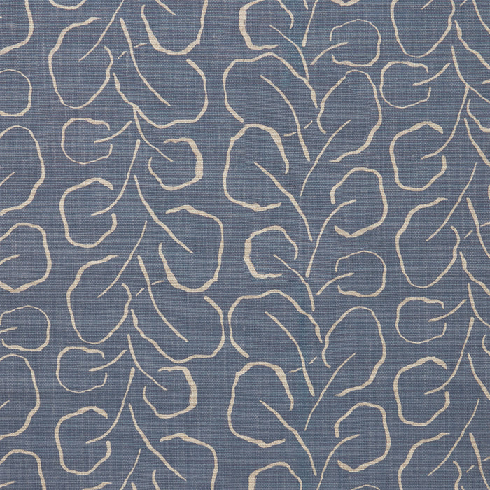 Woven fabric swatch with a large-scale repeating leaf print in tan on a French blue background.