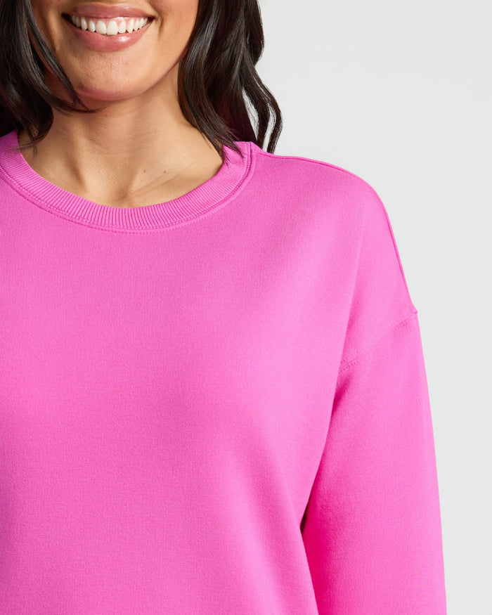 Womens Electric Fuchsia Slouch Pullover Crew worn by smiling person.