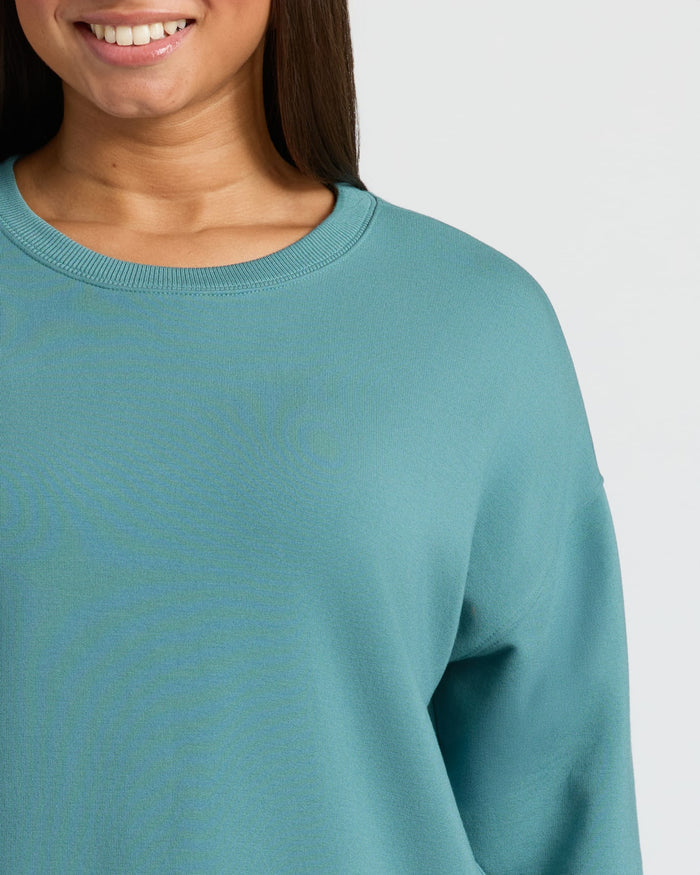Womens Stormcloud Slouch Pullover Crew on person, showcasing relaxed fit.