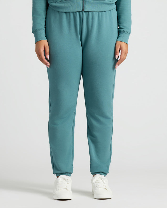Womens Stormcloud Slouch Pullover Crew & Relaxed Jogger with white sneakers.